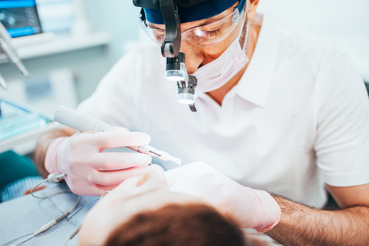 What type of dentist performs root canals?