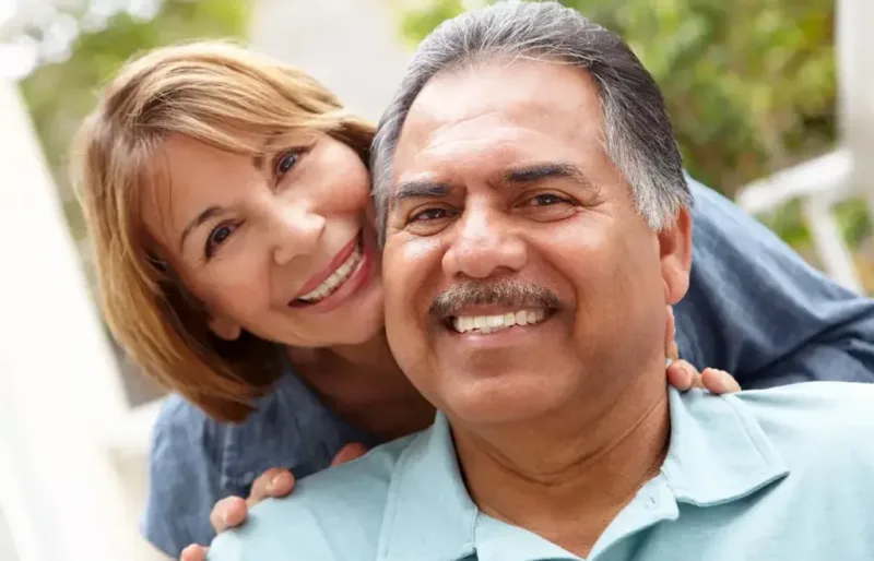 Couple smiling together outdoors